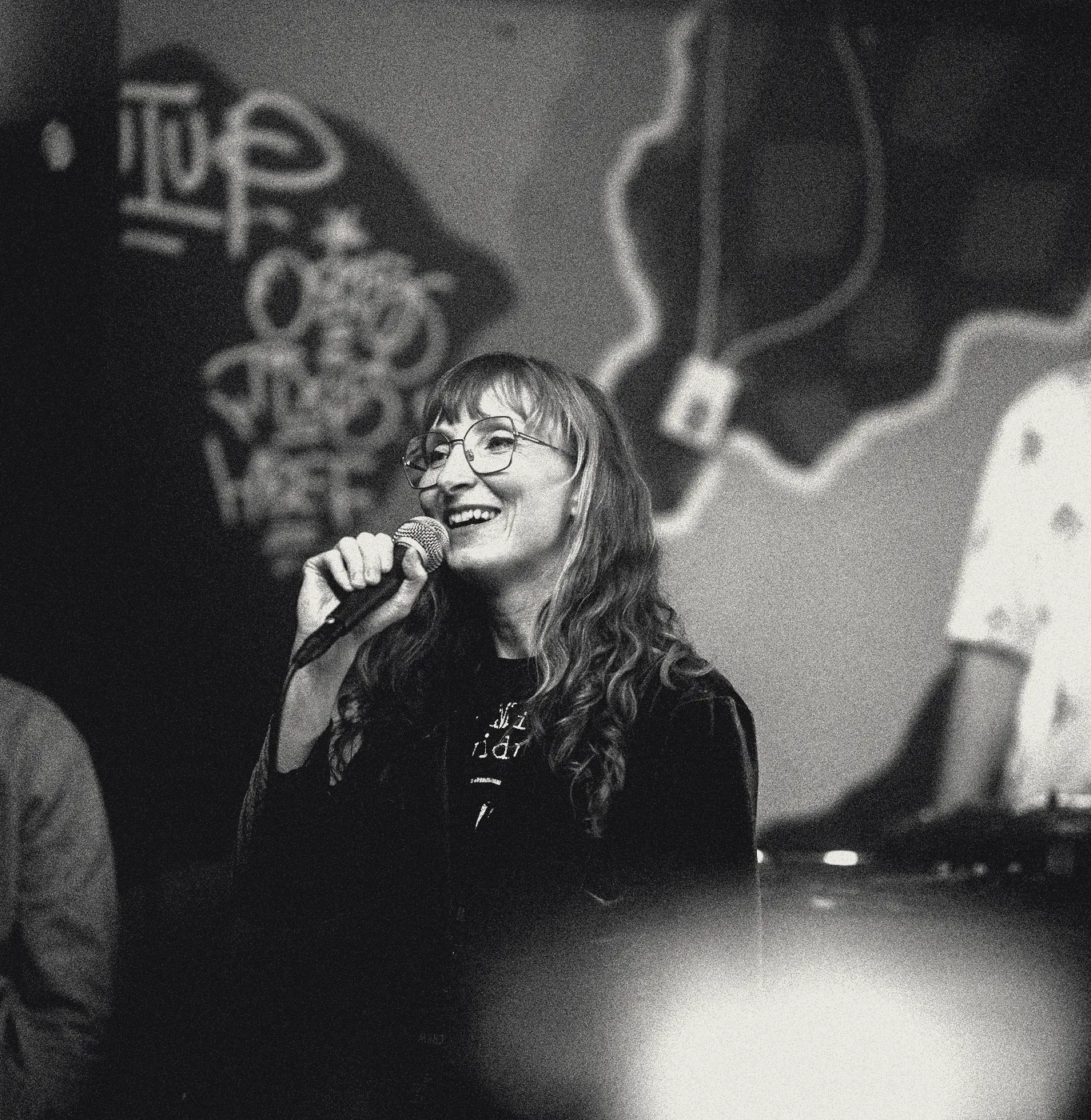 Sylvia singing in a dim club